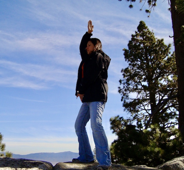 Standing meditation pose grounding on rock